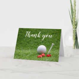 Golf boll med T och rött hjärta är på grönt Kort