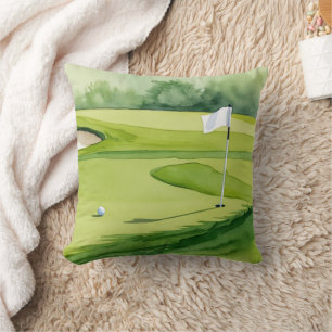Golf boll och flagga på grönt kudde