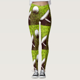 Golf boll och putter på grönt gräs leggings