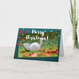 Golf järn och boll är på grönt jul kort