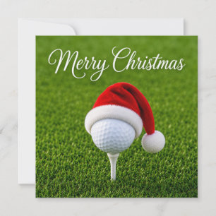 Golf jul med tomtehatt på grönt gräs kort