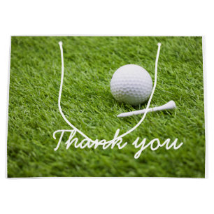 Golf Tack med golf boll och T på grönt