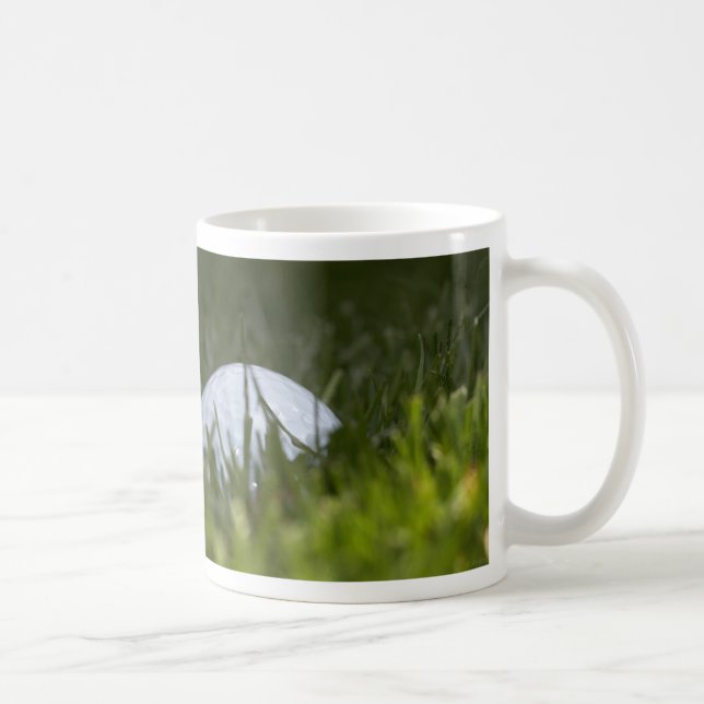 golfboll gömmer sig kaffemugg (Höger)