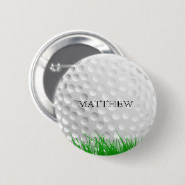 Golfboll i gräs knapp