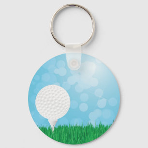 golfboll på gräs nyckelring
