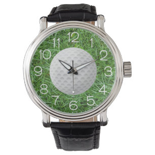 Golfboll på grönt gräs armbandsur