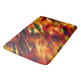 Golik nedfläckad från rött till orange, lite grönt badrumsmatta