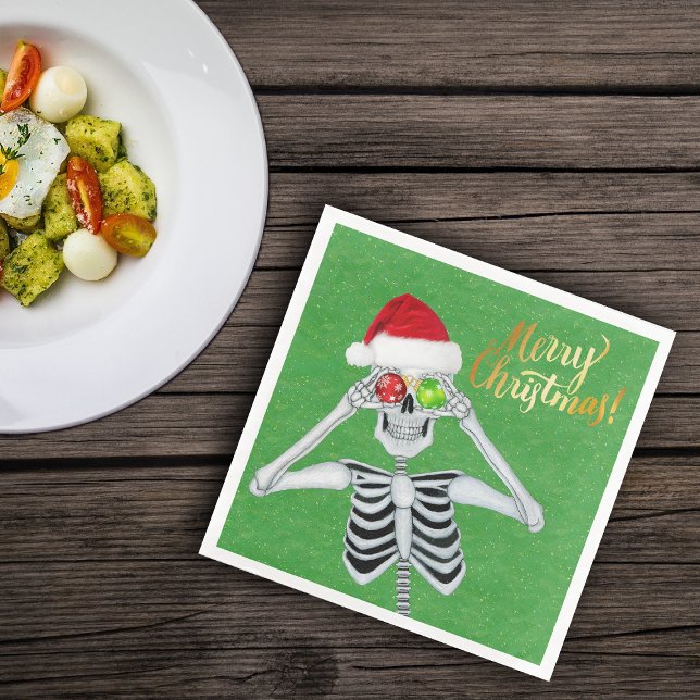 Goofy jul Skeleton Ornament Ögon Hat Grönt Pappersservett (Fun skeleton holding ornaments to eyes on green Merry Christmas paper party napkins)
