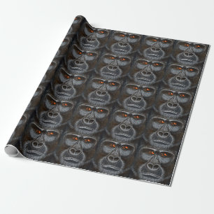 Gorillagåva som slår in papper presentpapper