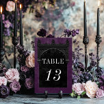 Gothic Black Raven & Black Arch Lila Bröllop Bordsnummer<br><div class="desc">Transportera dina gäster till en värld av mörk, och njuta av elegans med vårt vintage gothic bröllop bordsnummer-kort. Den djupa bakgrunden för royalet lila vid åldras anger scenen för en slående kontrast, eftersom fetstilt vit text kommer från invecklade svarta textrutor. I höjdpunkten på denna inbjudan fångas kärnan av mysteriet och...</div>