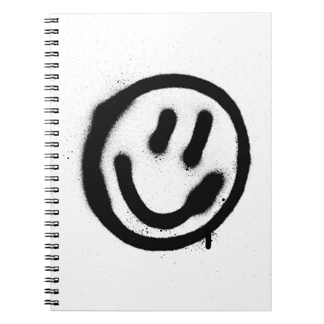 Graffiti leende ansikte-emoticon i svart på whites anteckningsbok (Framsidan)