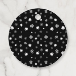 Grafik med flytande svarta, monokromatiska flingor gåvor etiketter