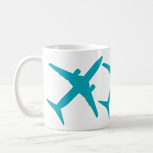 Grafiskt flygplan i akvablå kaffemugg (Vänster)