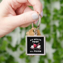 Grand Ideas på Hjul - 🎵 Piano Bok Fyrkantig Silverfärgad Nyckelring