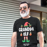 Grandpa elf-familjens matchande christmas-utrustni t shirt<br><div class="desc">Gå in i helgdag med den här roligten "Grandpa elf t-shirt" som är en del av en passande familjeåterförening som innehåller gåvor till någon familjemedlem. Perfekt för en återförening av julfamiljen, den här t-shirt-skjortan har en söt älvhatt och roligt ben, med texten "Grandpa elf" i ett vitt, modernt, versaltypsnitt. Skjortan...</div>