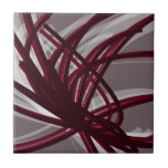 Grått & Burgundy Abstrakt Rosett band Kakelplatta<br><div class="desc">Modern konstnärlig design med burgundisk vin färgad rosett band med vita accenter på grått-bakgrund. Designat med vektorgrafik kan du skapa ditt eget anpassade dekorativ kudde genom att ändra bakgrunden och gräns färg. Om du vill skapa personligens utformning väljer du "anpassa" och navigerar till avsnittet lagrar för att visa bilder och...</div>