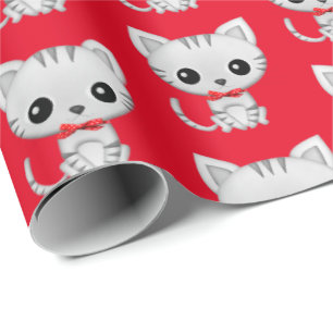 Grått kattunge på rött presentpapper
