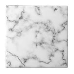 Grått och vit marble-effektruta kakelplatta<br><div class="desc">Den här plattan har en förfinad, vit marmordesign som markeras med mjuk grått-vinning. Den naturliga marmorn mönster erbjuder subtila detaljer och ett rent, klassiskt utseende som förbättrar både moderna och traditionella utrymmen. Med en jämn, glansig avsluta är plattan hållbar och lätt att underhålla - skapar den lämplig för ryggsplash, badrumsväggar...</div>