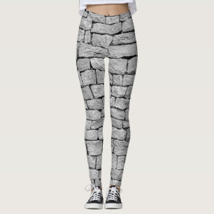 Grått-stenvägg, abstraktens bakgrund. leggings