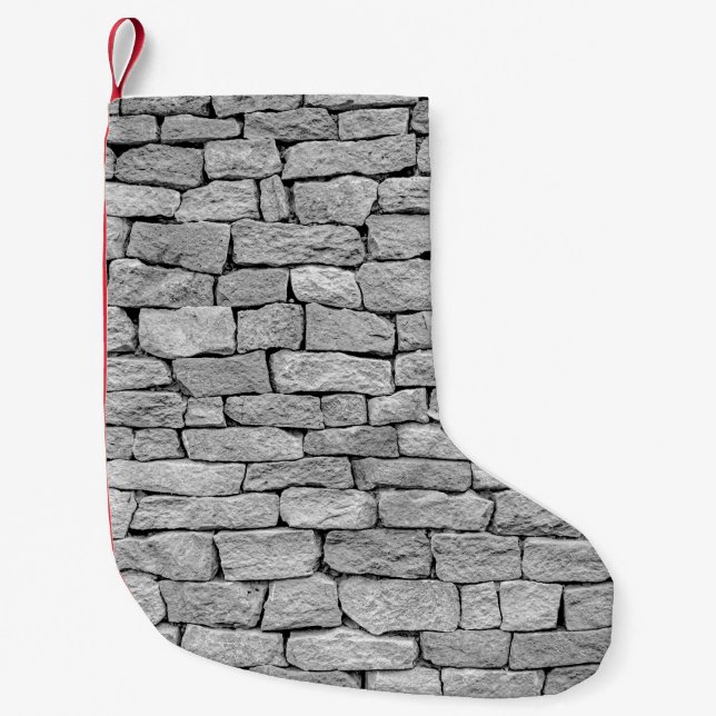 Grått-stenvägg, abstraktens bakgrund. liten julstrumpa (Framsidan)