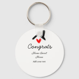 Gratulerar ny bosättningsägare vid invigningen av  nyckelring