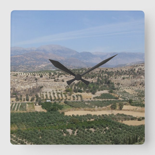 Greken landskap tar tid på fyrkantig klocka (Framsida)