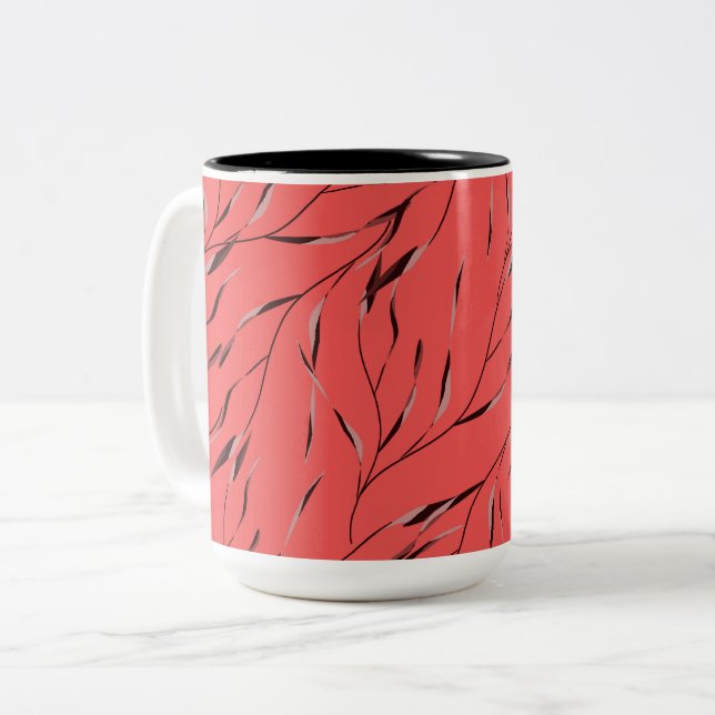 Grenar med blad på en röd bakgrund. Två-Tonad mugg (Framsida vänster)