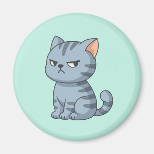 Grinig grå marmorerad katt på grönt magnet