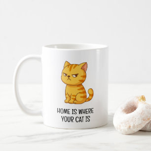 Grinig orange tabby katt kaffemugg