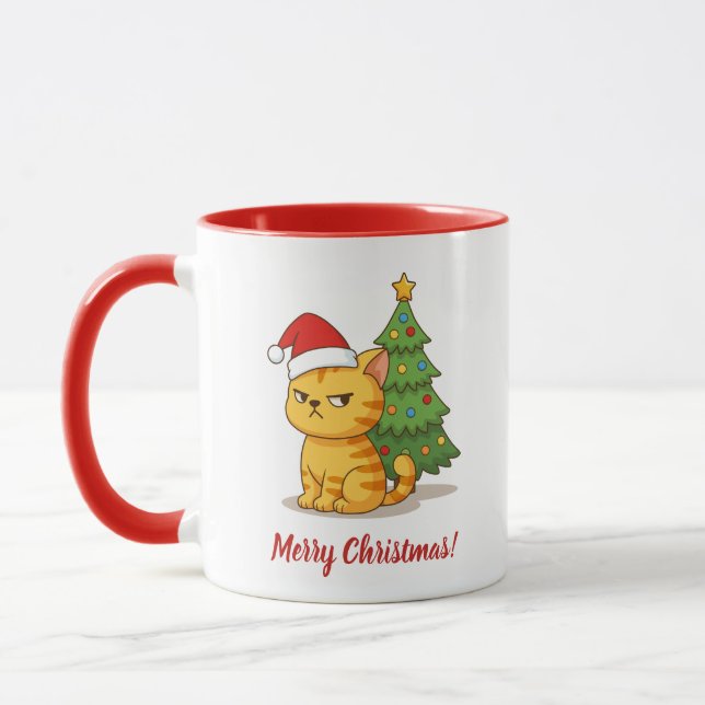 Grinig orange tabbykatt röd julhatt julgran mugg (Vänster)