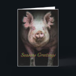 Grisfjulhälsningar Helgkort<br><div class="desc">En gris som går ut från en mörk lada med "God Jul" skrivet under ansiktet</div>