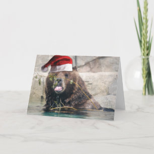 Grizzlybjörn i en tomtehatt helgkort