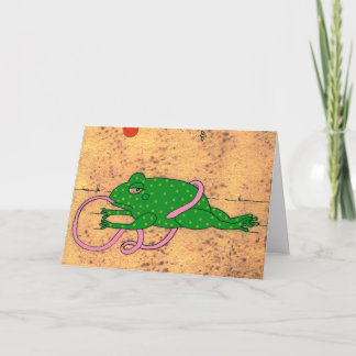 Groda som snubblar över dess tungahälsningkort kort