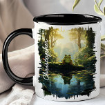 Groda vid skogsflod reflektion mugg<br><div class="desc">Fördjupa dig i naturens frid med Groda vid Skogsström Reflektionsmugg. Denna vackra mugg har en förtrollande bild av en groda som sitter på en sten vid en lugn skogsström, med frodig grönska och mjukt ljus som reflekteras i vattnet. Anpassad med ditt namn ger den en personlig och unik touch. Perfekt...</div>
