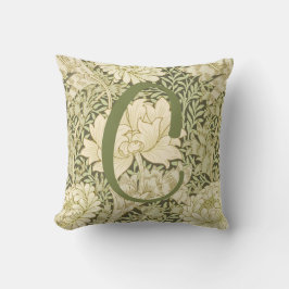 Grön blomsterrik William Morris-design med monogra Kudde