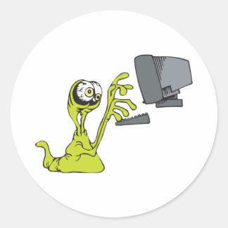 grön datortypande alienmonsterklump runt klistermärke