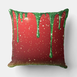 Grön glitterdroppe över röd bakgrund kudde