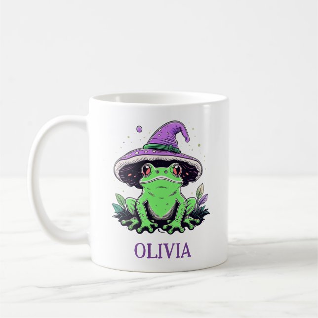 Grön groda som bär lila häxhatt kaffemugg (Vänster)