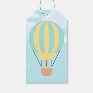 Grön och gul varmluftsballong på himlen  presentetikett