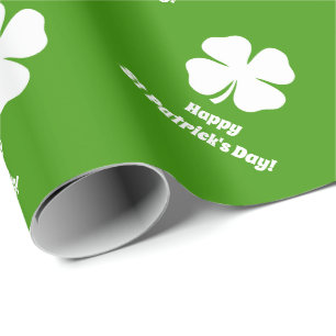 Grön st patrick's dayshamrock som slår in papper presentpapper