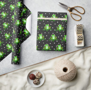 Gröna grodor på prickar presentpapper