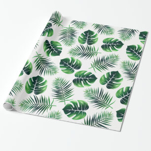 Gröna tropiska öhandflatanormbunksblad och presentpapper