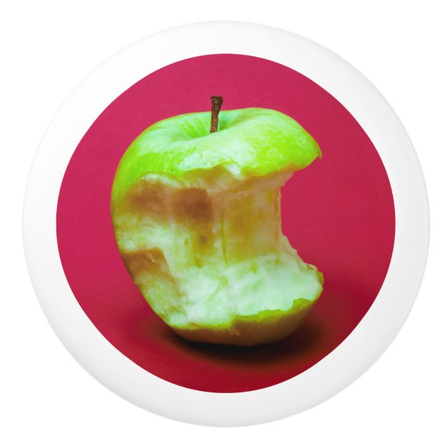 Grönt äpple på röd bakgrund knopp (Framsidan)
