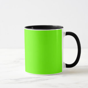 Grönt av ljusfluorescerande neon mugg