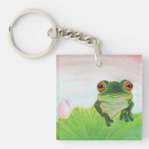 Grönt Frog bakom nyckelkedjan "lily pad"
