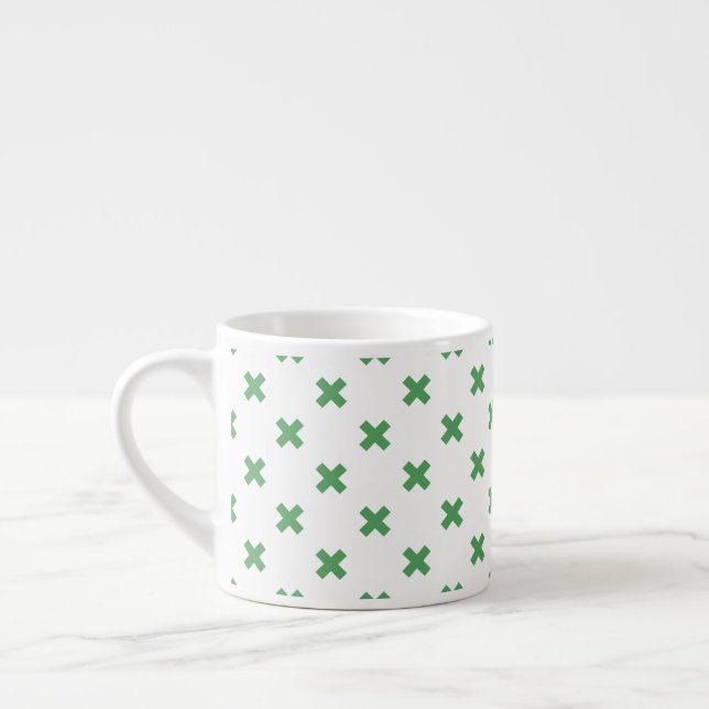 Grönt kor sytlar på vitt espressomugg (Vänster)