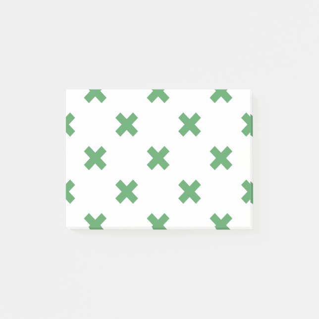 Grönt kor sytlar på vitt post-it block (Framsida)