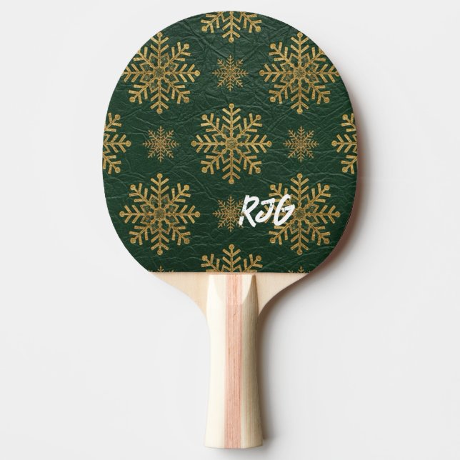 Grönt läder präglat med gyllene snöflingor och ini pingisracket (Framsidan)