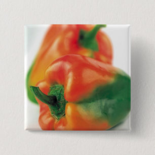 Grönt- och orangepeppar knapp