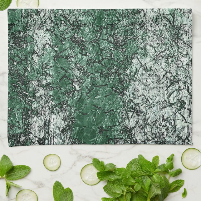 Grönt olja struktur på stift och lint kökshandduk (Vikta)